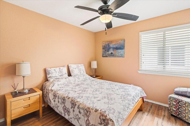 bedroom featuring wood finished floors and ceiling fan