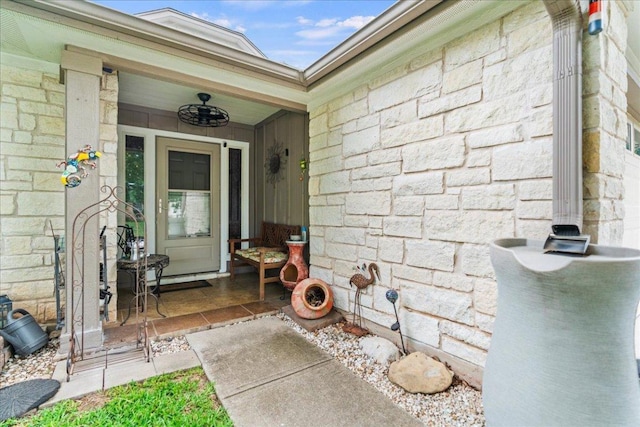 property entrance featuring stone siding