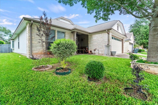 single story home featuring stone siding, an attached garage, and driveway
