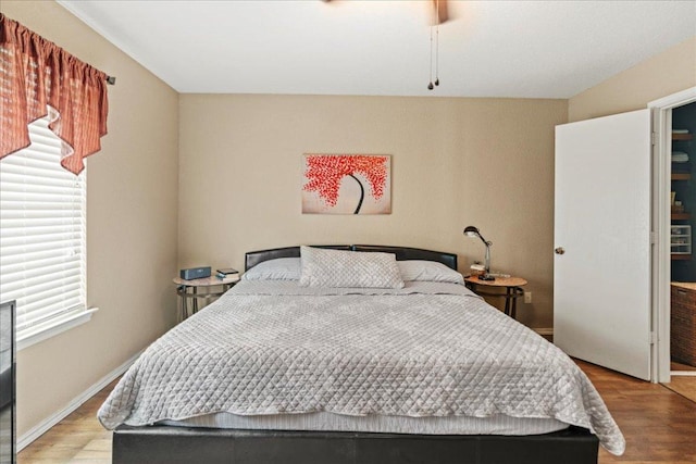 bedroom with wood finished floors
