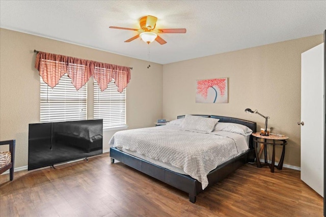 bedroom with wood finished floors and ceiling fan