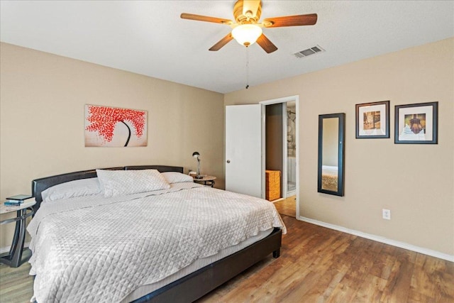 bedroom with wood finished floors and a ceiling fan