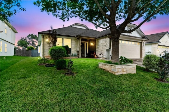 single story home with a garage, stone siding, board and batten siding, and concrete driveway