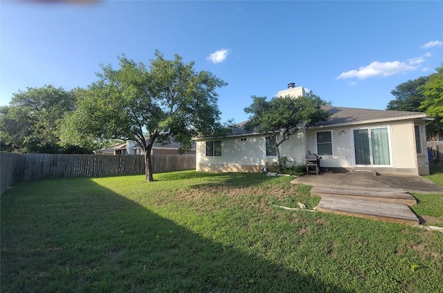1805 Timber Ridge Dr, Cedar Park, TX 78613 - rear view of house featuring a fenced backyard, a chimney, stucco siding, and a patio area