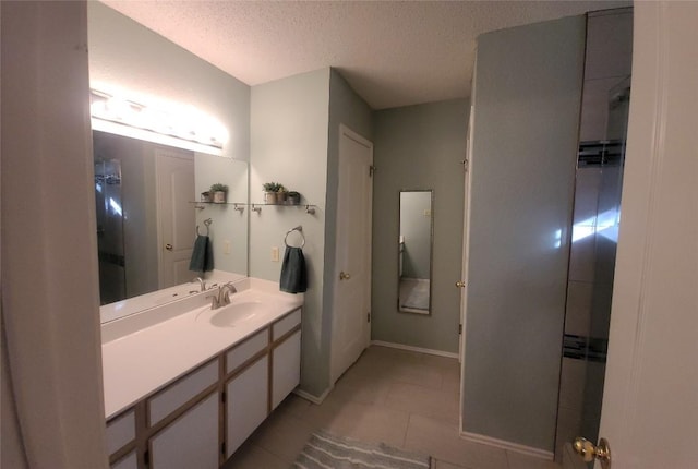 1805 Timber Ridge Dr, Cedar Park, TX 78613 - bathroom featuring a textured ceiling, vanity, and tile patterned flooring