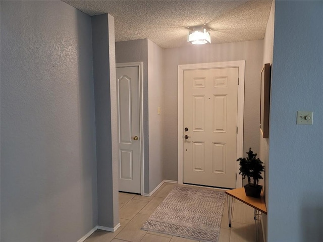 1805 Timber Ridge Dr, Cedar Park, TX 78613 - foyer featuring a textured ceiling and light tile patterned floors