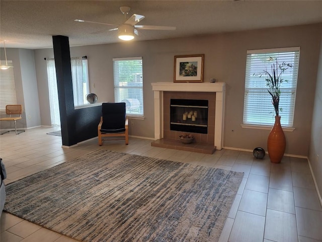 1805 Timber Ridge Dr, Cedar Park, TX 78613 - tiled living room featuring ceiling fan and a fireplace