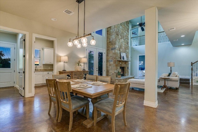 4275 Fm 3405, Georgetown, TX 78633 - dining area with finished concrete floors, ceiling fan, a high ceiling, and french doors