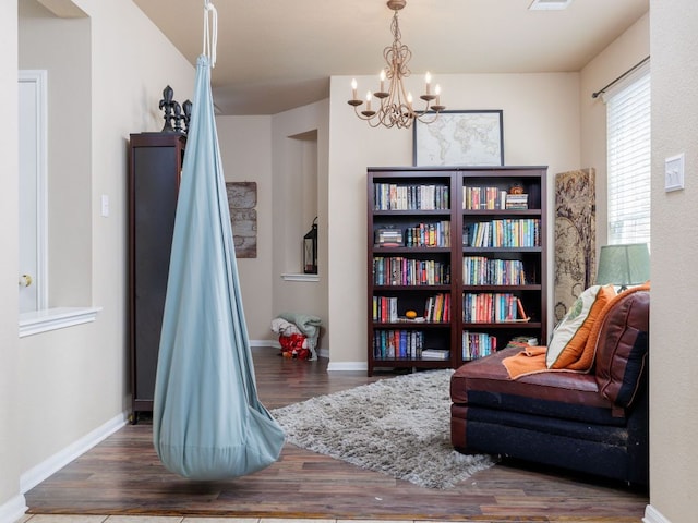 2407 Silver Spur Ln, Leander, TX 78641 - sitting room featuring wood finished floors and a chandelier