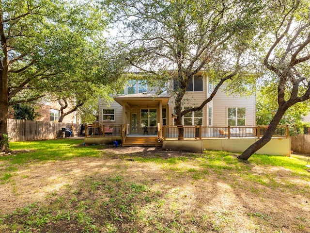 2407 Silver Spur Ln, Leander, TX 78641 - rear view of house with a fenced backyard and a wooden deck