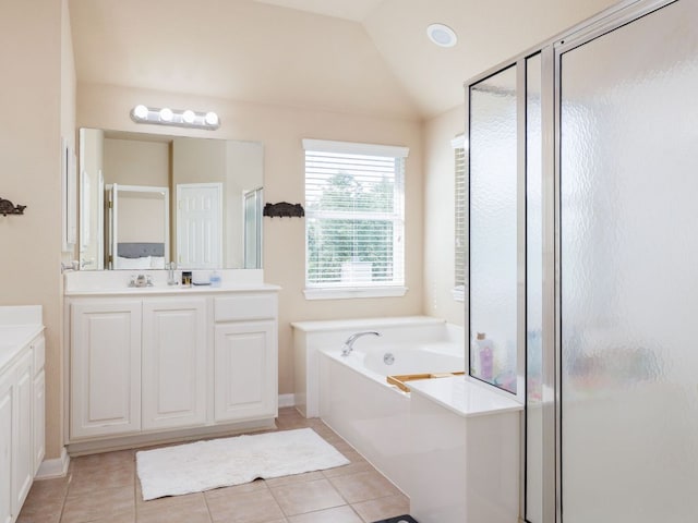 2407 Silver Spur Ln, Leander, TX 78641 - full bath with vanity, a shower stall, a garden tub, tile patterned floors, and vaulted ceiling