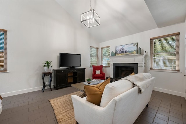 8600 Cima Oak Ln Unit A15, Austin, TX 78759 - living room featuring dark tile patterned floors, a fireplace, a chandelier, and high vaulted ceiling