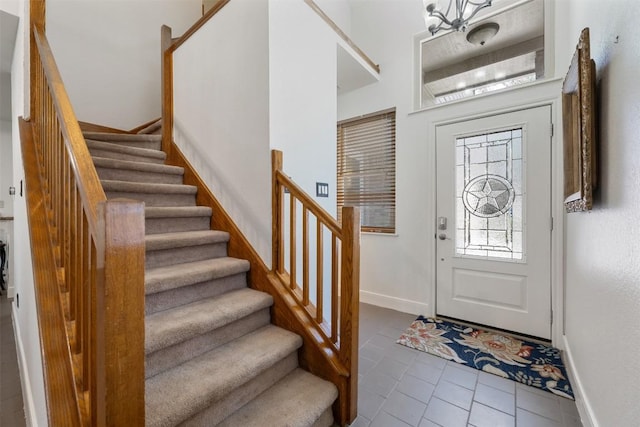 8600 Cima Oak Ln Unit A15, Austin, TX 78759 - tiled foyer featuring stairs and a chandelier
