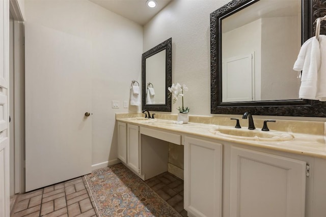 8600 Cima Oak Ln Unit A15, Austin, TX 78759 - bathroom with double vanity and brick patterned floors