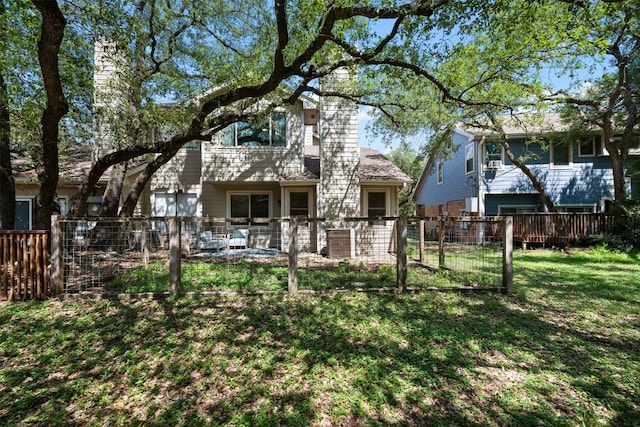 8600 Cima Oak Ln Unit A15, Austin, TX 78759 - rear view of house with a chimney