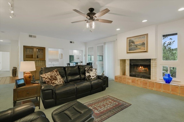 1707 Spyglass Dr Unit 41, Austin, TX 78746 - living area with a ceiling fan, carpet floors, a glass covered fireplace, and recessed lighting