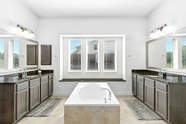 216 Tovas Secret Cv, Georgetown, TX 78628 - bathroom with plenty of natural light, a garden tub, and two vanities