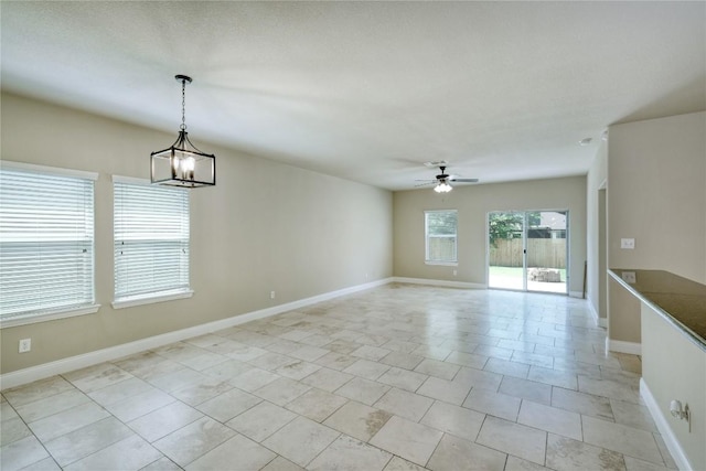 108 Tricia Ln, Hutto, TX 78634 - empty room featuring ceiling fan and a chandelier