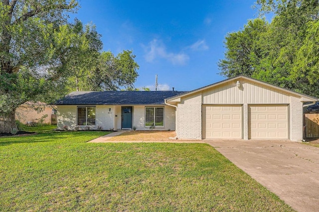 3013 Val Dr, Austin, TX 78723 - ranch-style house featuring a garage, driveway, a front yard, and brick siding