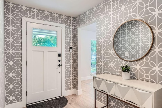 3013 Val Dr, Austin, TX 78723 - foyer entrance featuring wallpapered walls and light wood finished floors