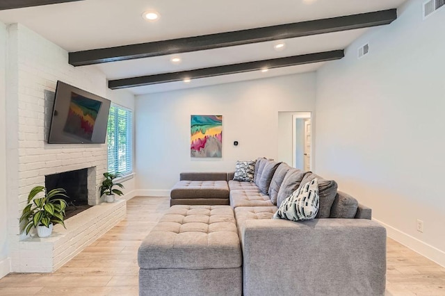 3013 Val Dr, Austin, TX 78723 - living area featuring recessed lighting, light wood-style floors, a fireplace, and beamed ceiling