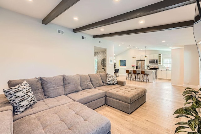 3013 Val Dr, Austin, TX 78723 - living area with light wood finished floors, recessed lighting, and beam ceiling