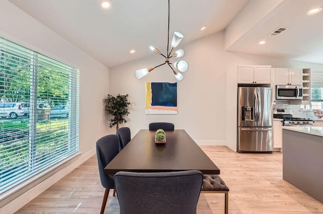 3013 Val Dr, Austin, TX 78723 - dining area featuring light wood-style floors, a chandelier, recessed lighting, and vaulted ceiling