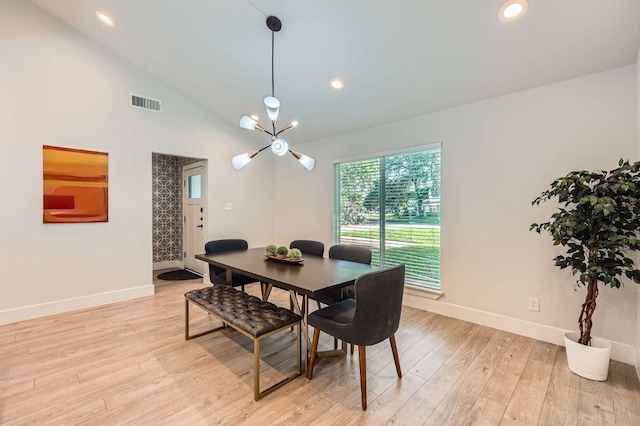 3013 Val Dr, Austin, TX 78723 - dining room with light wood finished floors, lofted ceiling, a chandelier, and recessed lighting