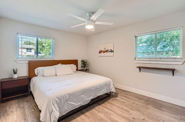 3013 Val Dr, Austin, TX 78723 - bedroom with wood finished floors and ceiling fan