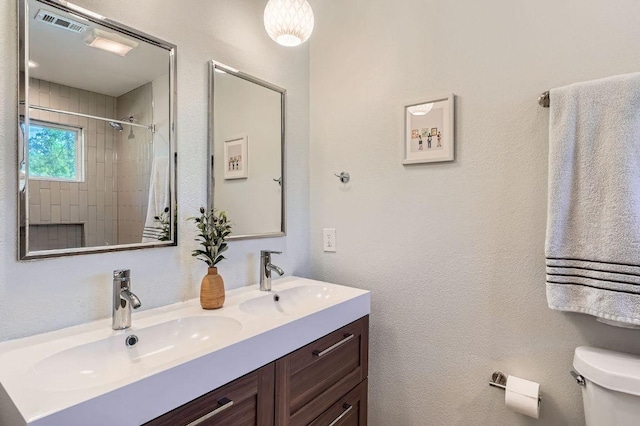 3013 Val Dr, Austin, TX 78723 - bathroom with double vanity and a tile shower