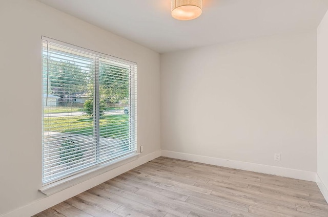 3013 Val Dr, Austin, TX 78723 - empty room with light wood finished floors and baseboards