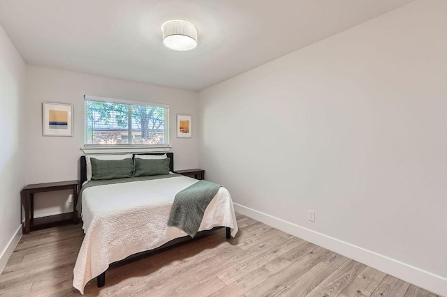 3013 Val Dr, Austin, TX 78723 - bedroom with light wood-type flooring and baseboards