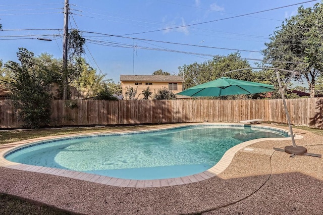 3013 Val Dr, Austin, TX 78723 - view of swimming pool with a fenced backyard and a diving board