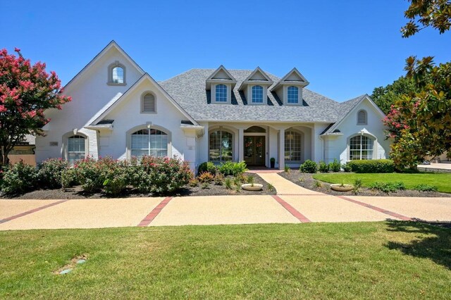 2314 Camino Del Verdes Pl, Round Rock, TX 78681 - view of front of house featuring a front yard and a shingled roof