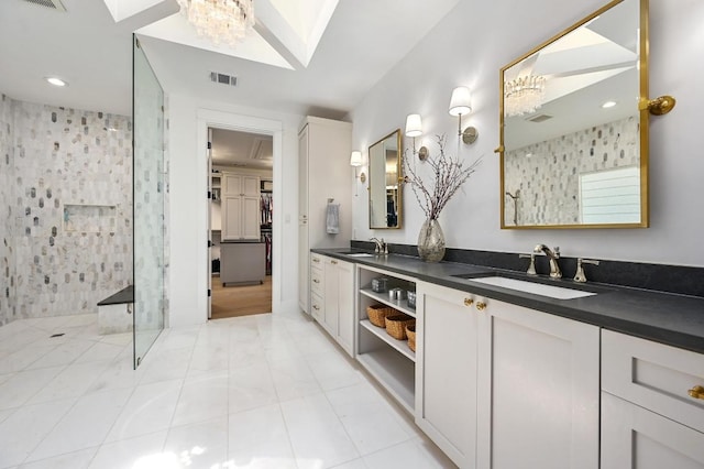 2314 Camino Del Verdes Pl, Round Rock, TX 78681 - full bath featuring walk in shower, double vanity, a chandelier, recessed lighting, and a skylight