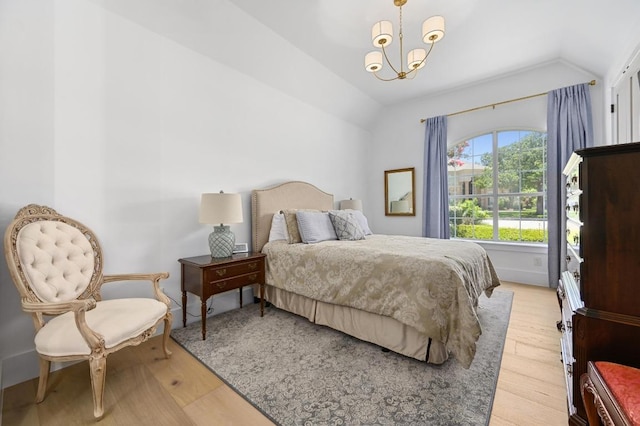 2314 Camino Del Verdes Pl, Round Rock, TX 78681 - bedroom with lofted ceiling, light wood-style flooring, and a chandelier
