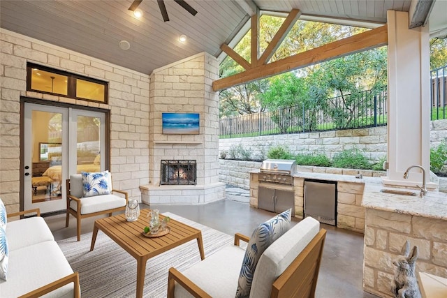 604 Flamingo Cv, Lakeway, TX 78734 - view of patio with area for grilling, an outdoor living space with a fireplace, and ceiling fan