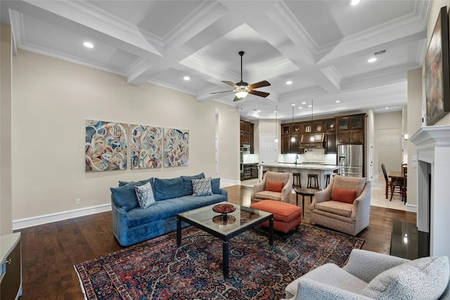 604 Flamingo Cv, Lakeway, TX 78734 - living area featuring a ceiling fan, coffered ceiling, dark wood finished floors, beam ceiling, and crown molding
