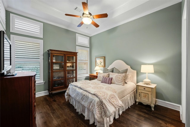 604 Flamingo Cv, Lakeway, TX 78734 - bedroom featuring dark wood-style flooring, multiple windows, ornamental molding, and ceiling fan