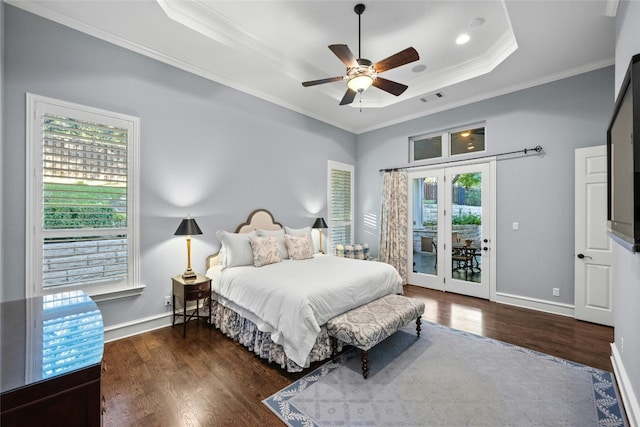 604 Flamingo Cv, Lakeway, TX 78734 - bedroom featuring a raised ceiling, access to outside, multiple windows, ornamental molding, and wood finished floors