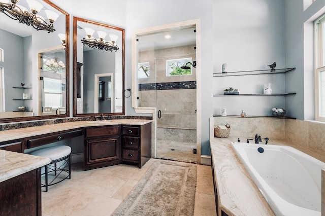 604 Flamingo Cv, Lakeway, TX 78734 - full bathroom featuring healthy amount of natural light, a shower stall, a bath, and vanity