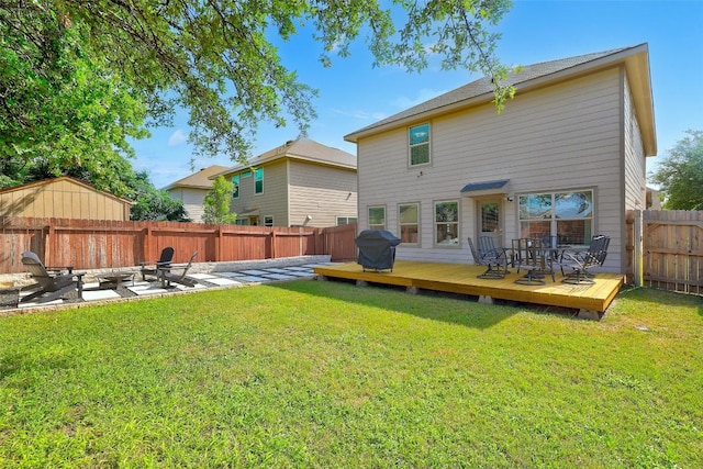 140 Housefinch Loop, Leander, TX 78641 - rear view of property featuring a fenced backyard, a deck, and a patio