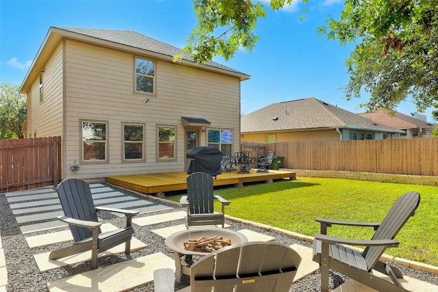 140 Housefinch Loop, Leander, TX 78641 - back of property with an outdoor fire pit, a deck, a fenced backyard, and a patio