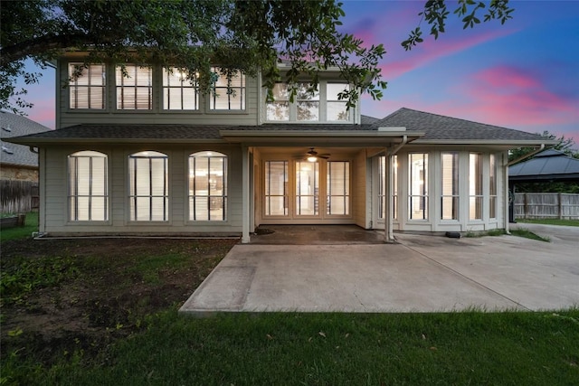 3443 Cortes Pl, Round Rock, TX 78665 - back of house at dusk with a patio, a shingled roof, a gazebo, and ceiling fan