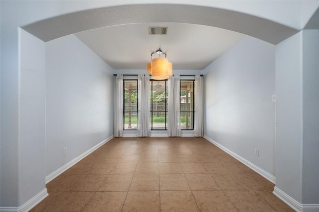 3443 Cortes Pl, Round Rock, TX 78665 - tiled empty room featuring arched walkways