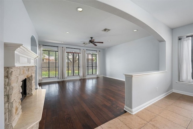 3443 Cortes Pl, Round Rock, TX 78665 - unfurnished living room featuring a fireplace, a ceiling fan, wood-type flooring, and recessed lighting