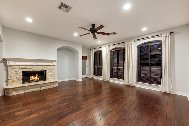 3443 Cortes Pl, Round Rock, TX 78665 - unfurnished living room with ceiling fan, hardwood / wood-style floors, recessed lighting, a fireplace, and arched walkways