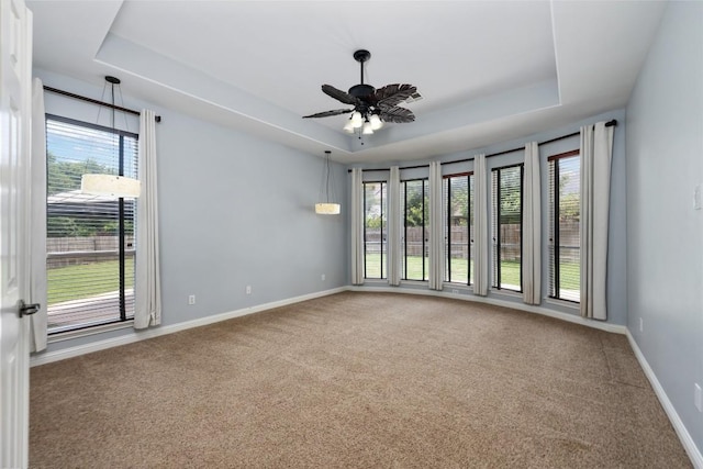 3443 Cortes Pl, Round Rock, TX 78665 - carpeted empty room with a raised ceiling and a ceiling fan