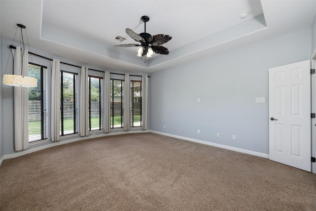 3443 Cortes Pl, Round Rock, TX 78665 - carpeted empty room featuring a tray ceiling and ceiling fan