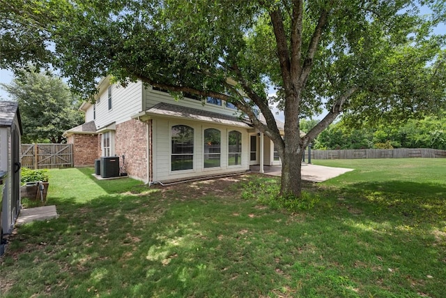 3443 Cortes Pl, Round Rock, TX 78665 - rear view of house with brick siding, a patio, and a fenced backyard